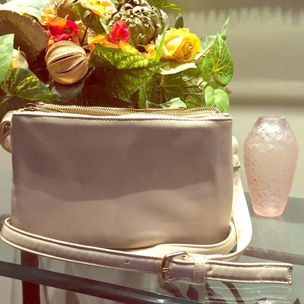 Cream colored crossbody or shoulder purse